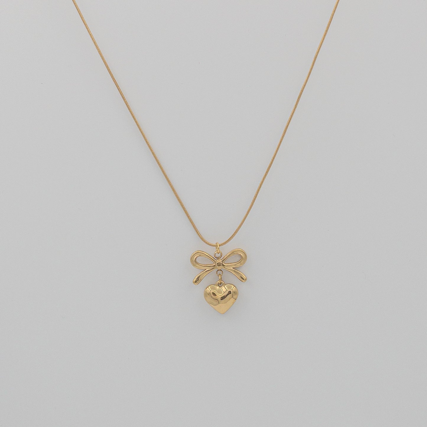 "Coquette" Golden Bow & Dangling Heart Necklace