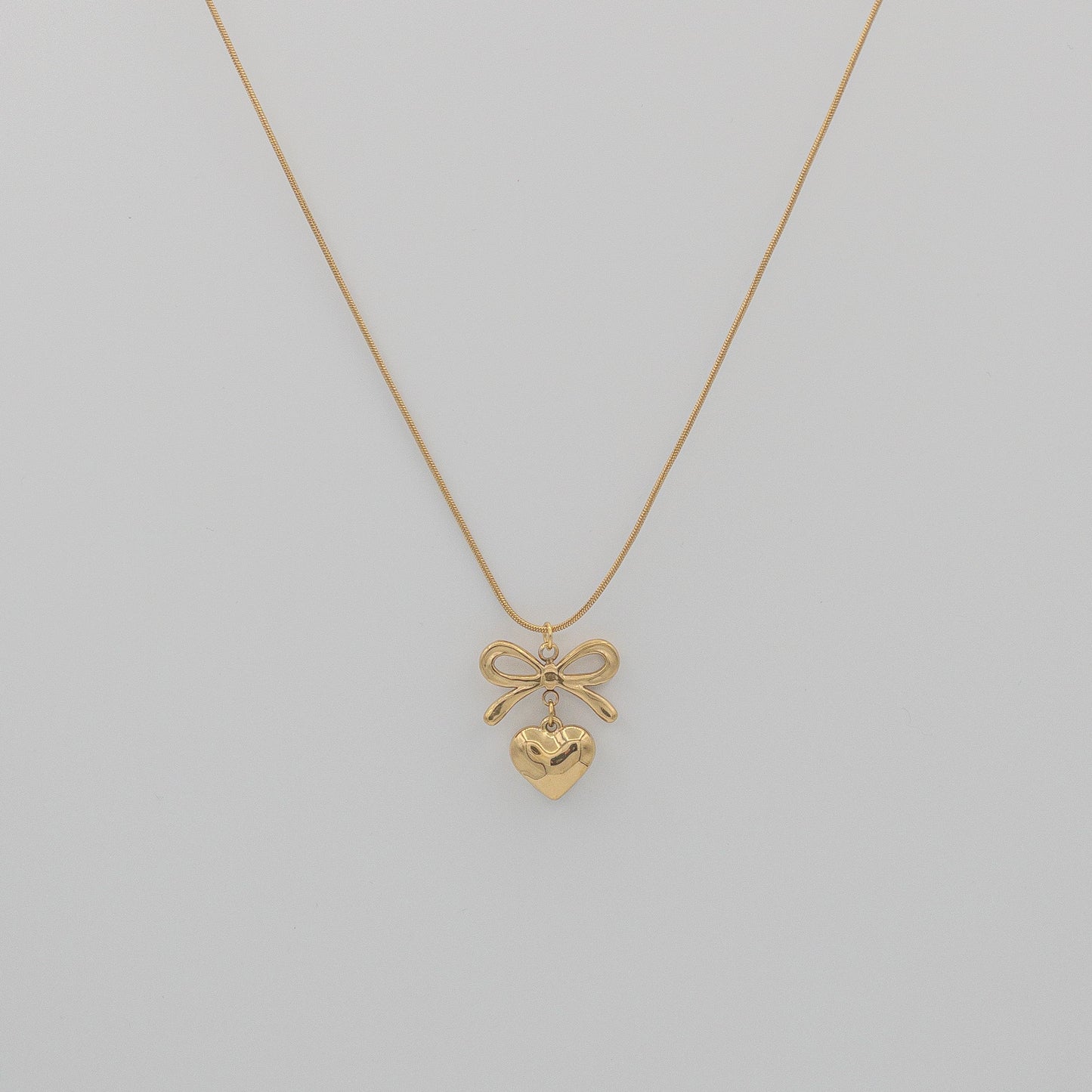 "Coquette" Golden Bow & Dangling Heart Necklace