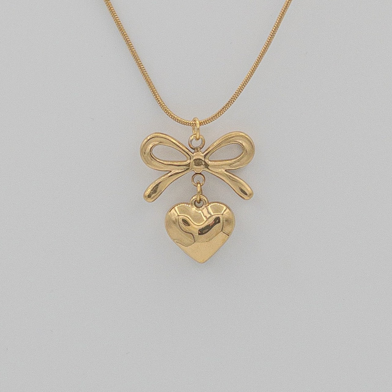 "Coquette" Golden Bow & Dangling Heart Necklace
