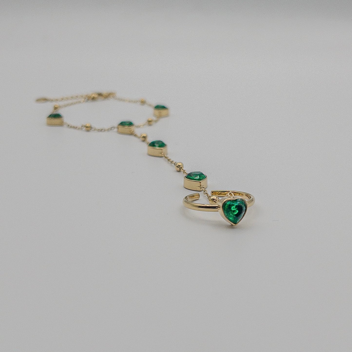 The Emerald Heart Hand Chain Bracelet (Modern Hath Phool)